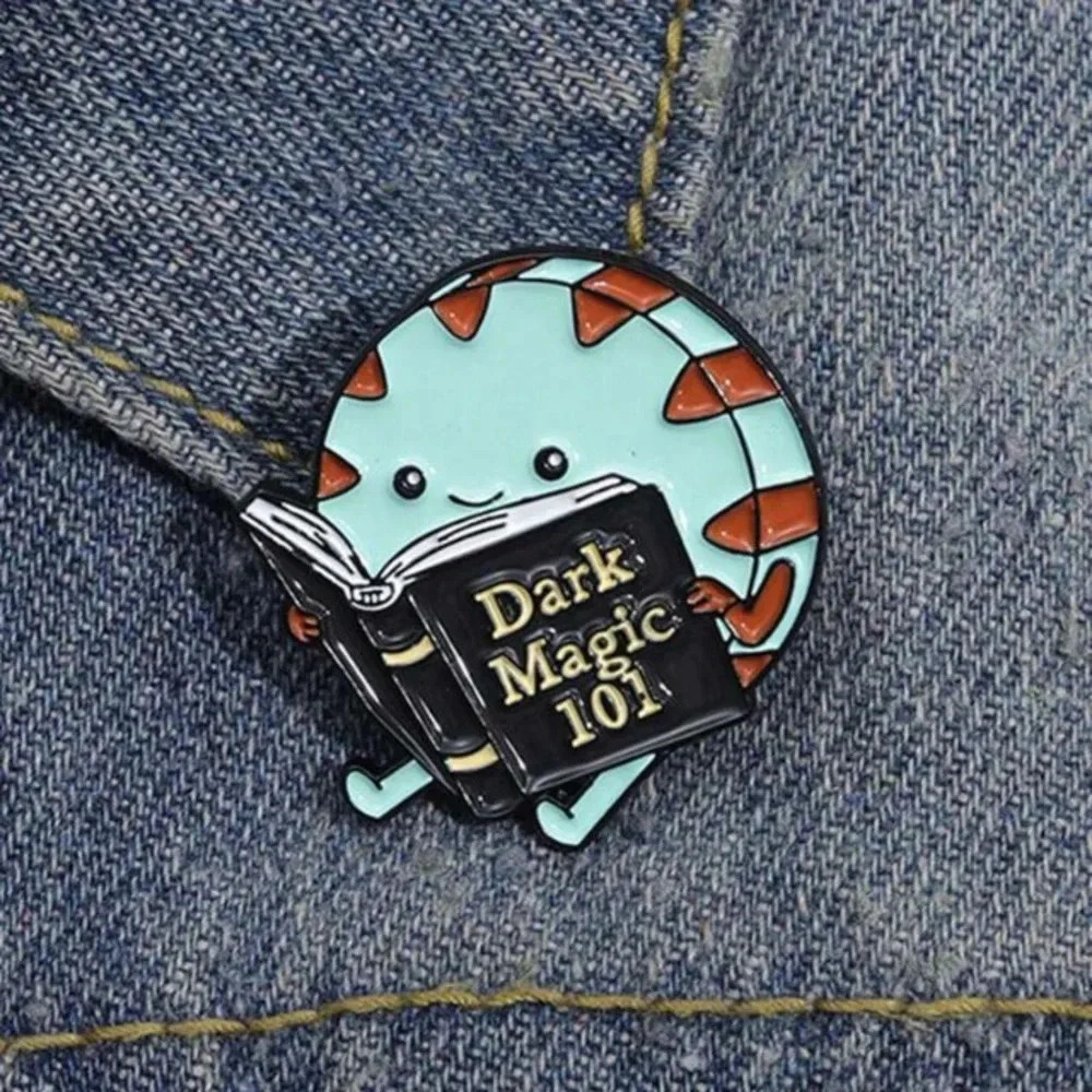 Blue black red cartoon character book Dark Magic 101 enamel pin bag clothes hat